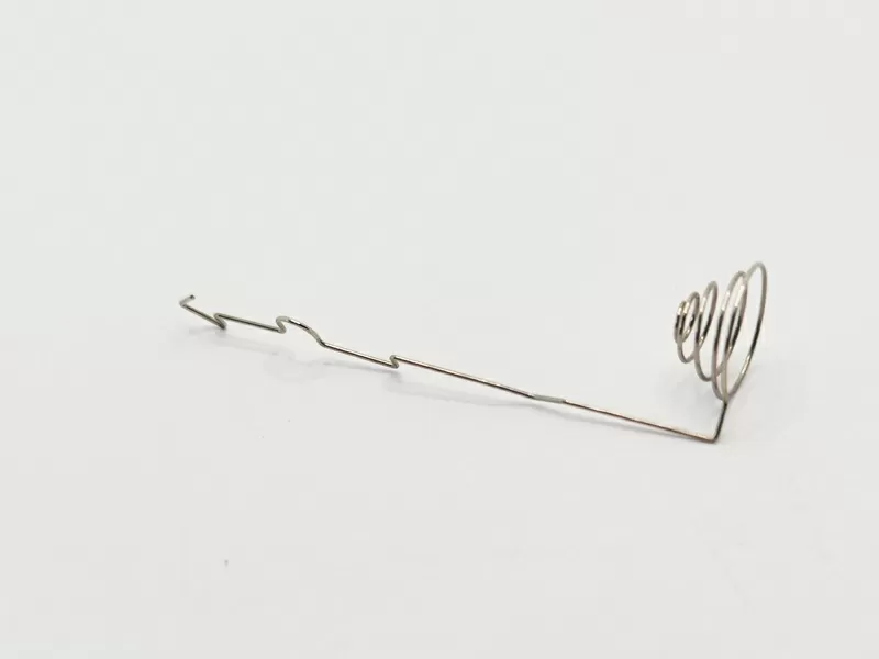 Metal Spring Contact with Coil Spring Buffer and Geometrically Bent Contact Arm